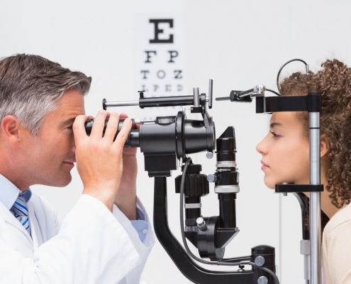 Optometrist giving an eye exam