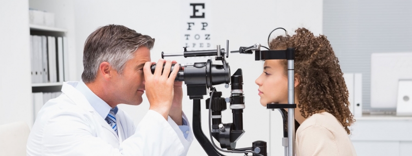 Optometrist giving an eye exam