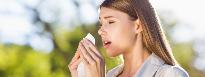 beautiful-woman-using-tissue-while-sneezing