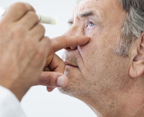 Elderly man examined by an ophthalmologist