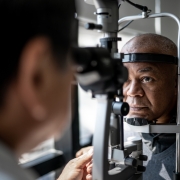 Ophthalmologist examining patient's eyes