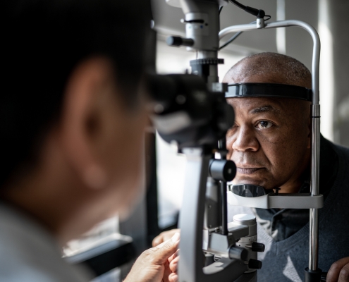 Ophthalmologist examining patient's eyes