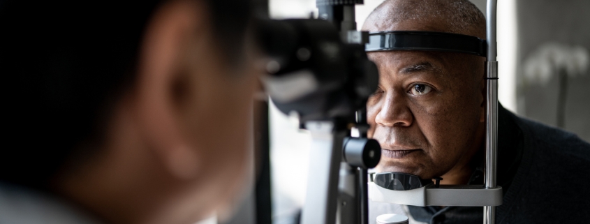 Ophthalmologist examining patient's eyes